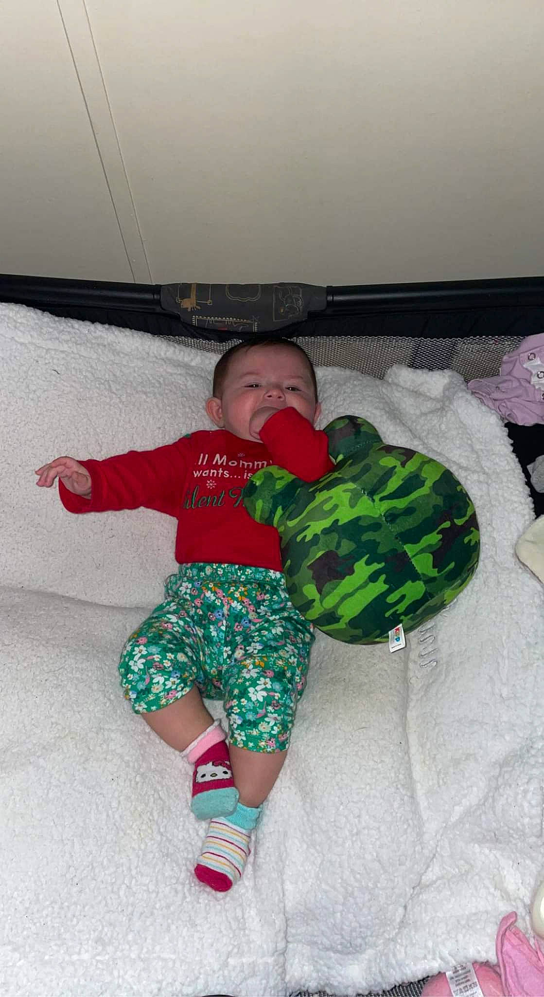 Raelynn is registered to the contest to win money with this photo: baby, baby_toddler_clothing, child, comfort, couch, fun, grass, happy, leaf_vegetable, leg, leisure, linens, pattern, person, play, room, sock, thigh, toddler