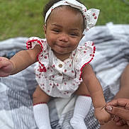 Erynomie joined the competition — help win amazing prizes! baby, child, infant, smiling, headband, outdoor, grass, blanket, hand, holding, white_socks, cute, portrait, person, young_child, happy, summer, fashion, playful, skin