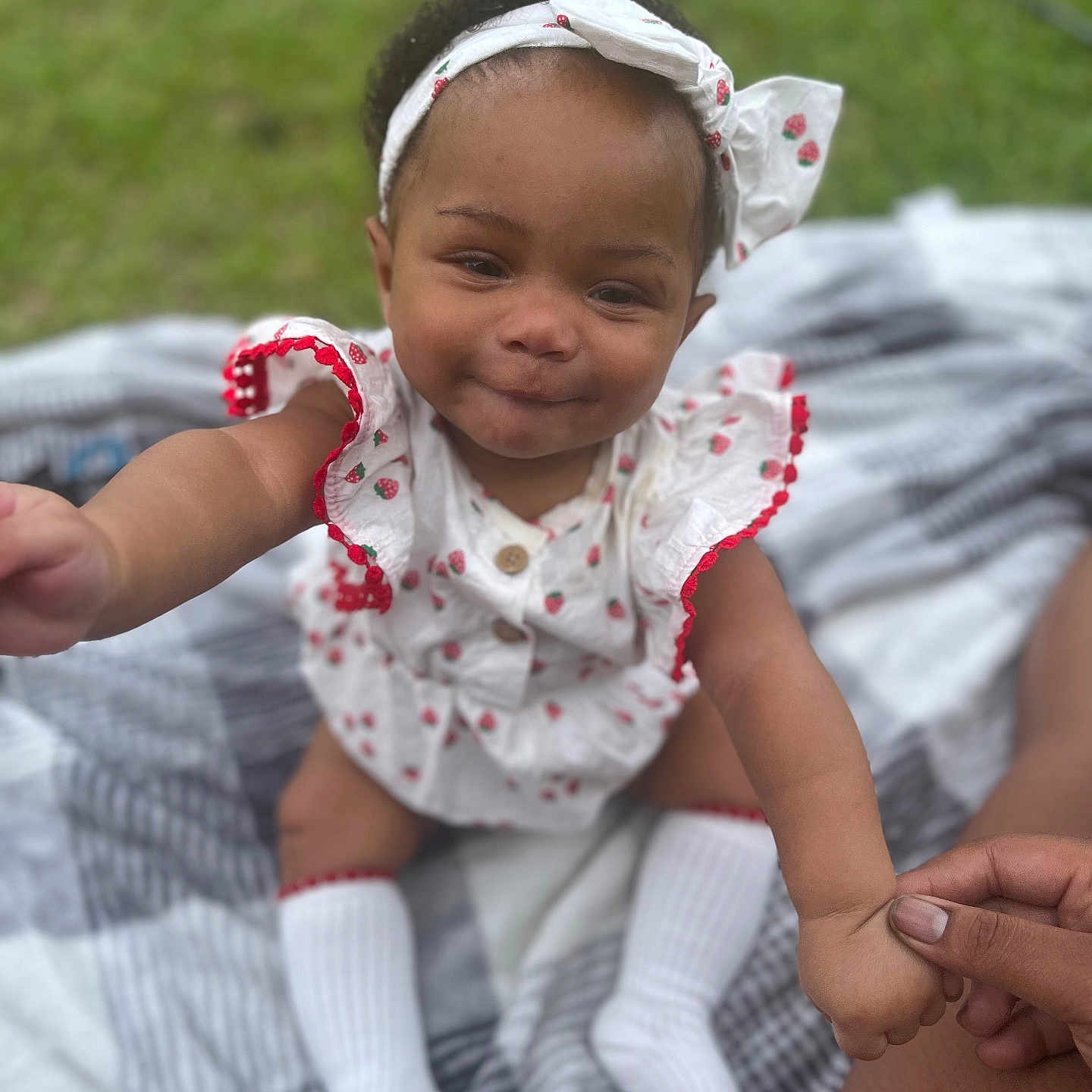 Erynomie joined the competition — help win amazing prizes! baby, child, infant, smiling, headband, outdoor, grass, blanket, hand, holding, white_socks, cute, portrait, person, young_child, happy, summer, fashion, playful, skin