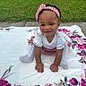 Erynomie is registered to the contest to win money with this photo: baby, child, crawling, headband, outdoor, grass, blanket, floral, smile, happy, person, toddler, greenery, nature, cute, young, clothing, pattern, garden, portrait