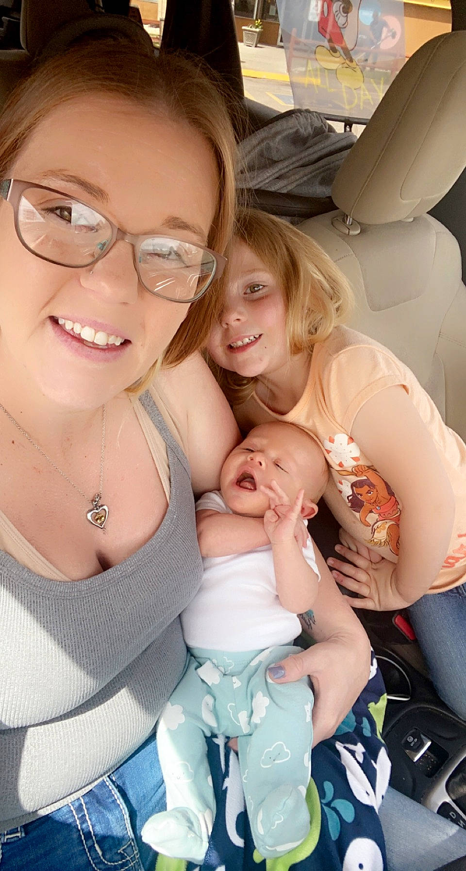 Emberlee is registered to the contest to win money with this photo: baby, child, comfort, event, eyewear, facial_expression, finger, fun, gesture, glasses, hairstyle, happy, joy, person, product, selfie, sitting, skin, smile, toddler