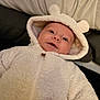 Jayce is registered to the contest to win money with this photo: baby, child, onesie, white, hood, ears, smile, face, infant, cute, warm, fur, clothing, portrait, indoor, cuddly, soft, happy, young, person