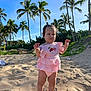 toddler, child, beach, sand, palm_trees, sunny, outdoor, blue_sky, greenery, pink_clothing, barefoot, cute, summer, nature, portrait, young_child, vacation, sunlight, small_hands, determined