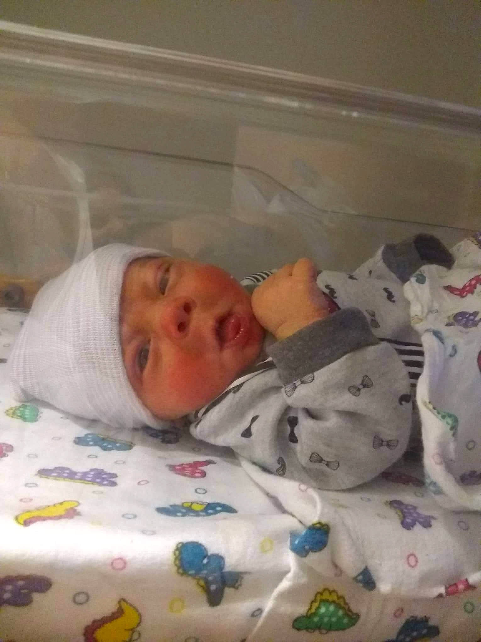 Joseph is registered to the contest to win money with this photo: baby, baby_products, baby_safety, baby_sleeping, baby_toddler_clothing, bed, bedding, bedtime, birth, cheek, child, childbirth, comfort, eyebrow, headwear, infant_bed, linens, nose, person, product