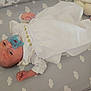 baby, pacifier, blanket, crib, toy, infant, sleeping, bed, child, white_clothing, soft_toy, pattern, clouds, lying_down, newborn, pale_skin, cute, peaceful, indoors, mattress