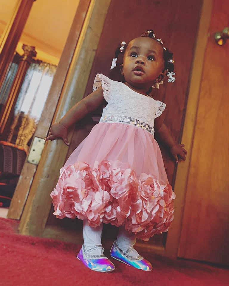 Emani is registered to the contest to win money with this photo: child, child_model, dress, fashion_design, peach, person, pink, toddler