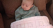 Alice joined the competition — help win amazing prizes! baby, blanket, brown, child, clothing, comfort, couch, cozy, crochet, fabric, head, indoor, peaceful, person, plaid, portrait, resting, sleeping, soft, young