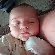 Alice joined the competition — help win amazing prizes! baby, sleeping, infant, face, cheeks, hand, sleeve, clothing, couch, person, rest, cozy, closeup, indoors, peaceful, soft, skin, nap, portrait, young