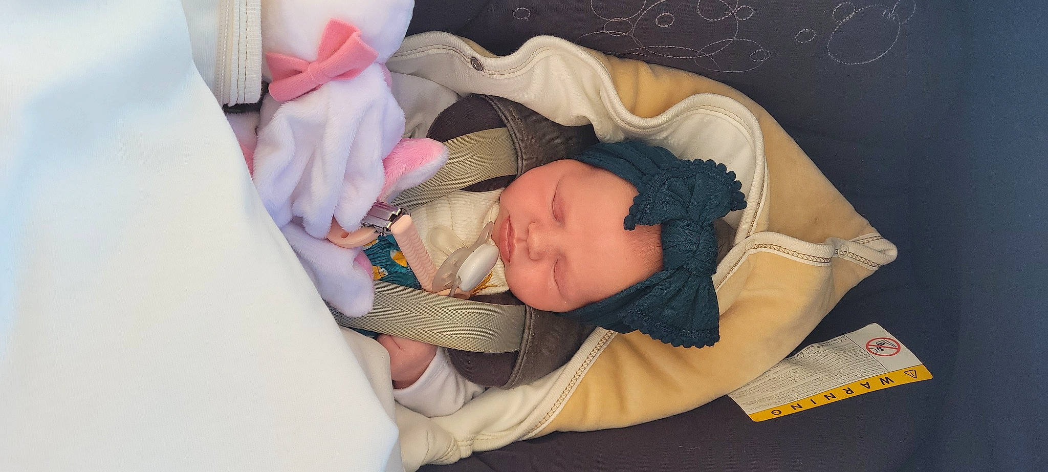 Loeline participe au concours pour gagner de l'argent avec cette photo : baby, baby_carriage, baby_products, baby_safety, baby_sleeping, baby_toddler_clothing, bedtime, cheek, child, comfort, eyelash, headwear, infant_bed, linens, nap, pattern, person, product, room, sleep