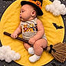 baby, infant, child, sleeping, halloween, witch_hat, pumpkin, broomstick, costume, yellow_blanket, clouds, stars, bats, portrait, indoor, photography, cute, baby_booties, dark_background, festive