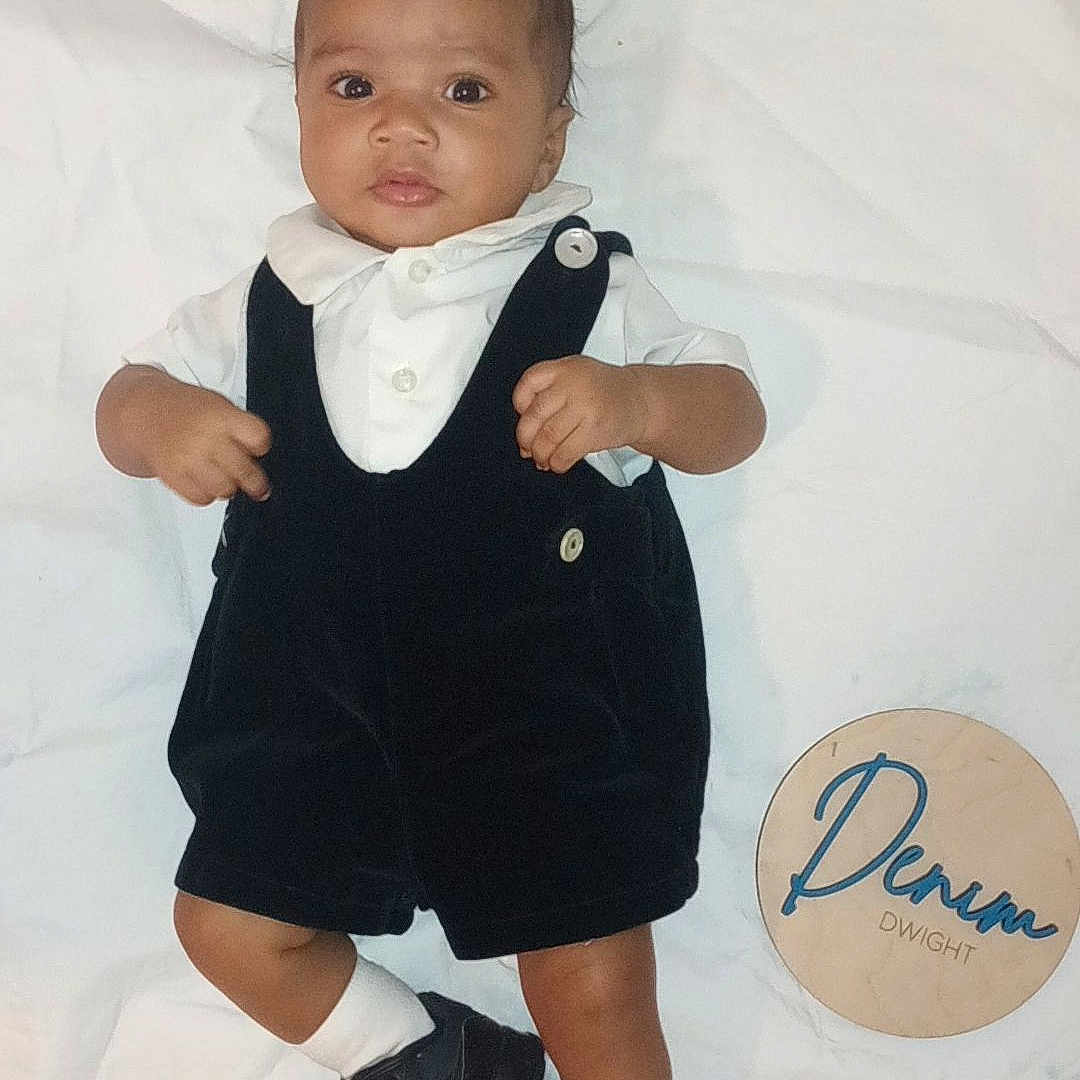 Denim joined the competition — help win amazing prizes! baby, blazer, clothing, costume, face, footwear, formalwear, head, jeans, pants, person, photography, portrait, shirt, shoe, shorts, sitting, sneaker, suit, text