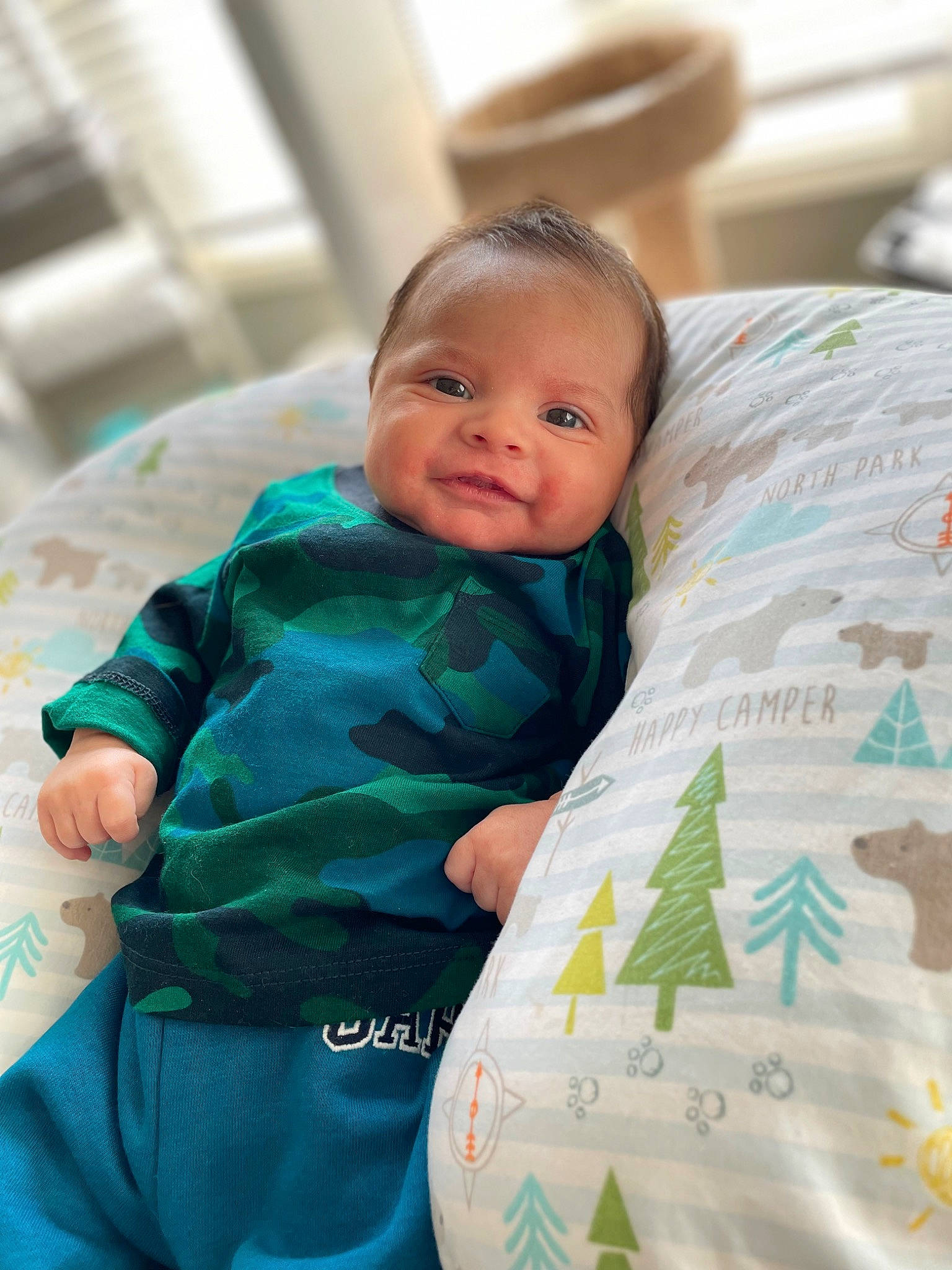 Jace joined the competition — help win amazing prizes! baby, baby_toddler_clothing, bed_sheet, bedding, child, comfort, design, event, happy, linens, mammal, pattern, person, product, room, sitting, skin, sleeve, smile, t_shirt