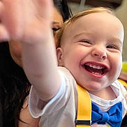 Hunter is registered to the contest to win money with this photo: toddler, child, smiling, happy, face, hand, blue_bow_tie, yellow_suspender, white_shirt, person, indoor, adult, glasses, closeup, joy, baby, cute, expression, portrait, family