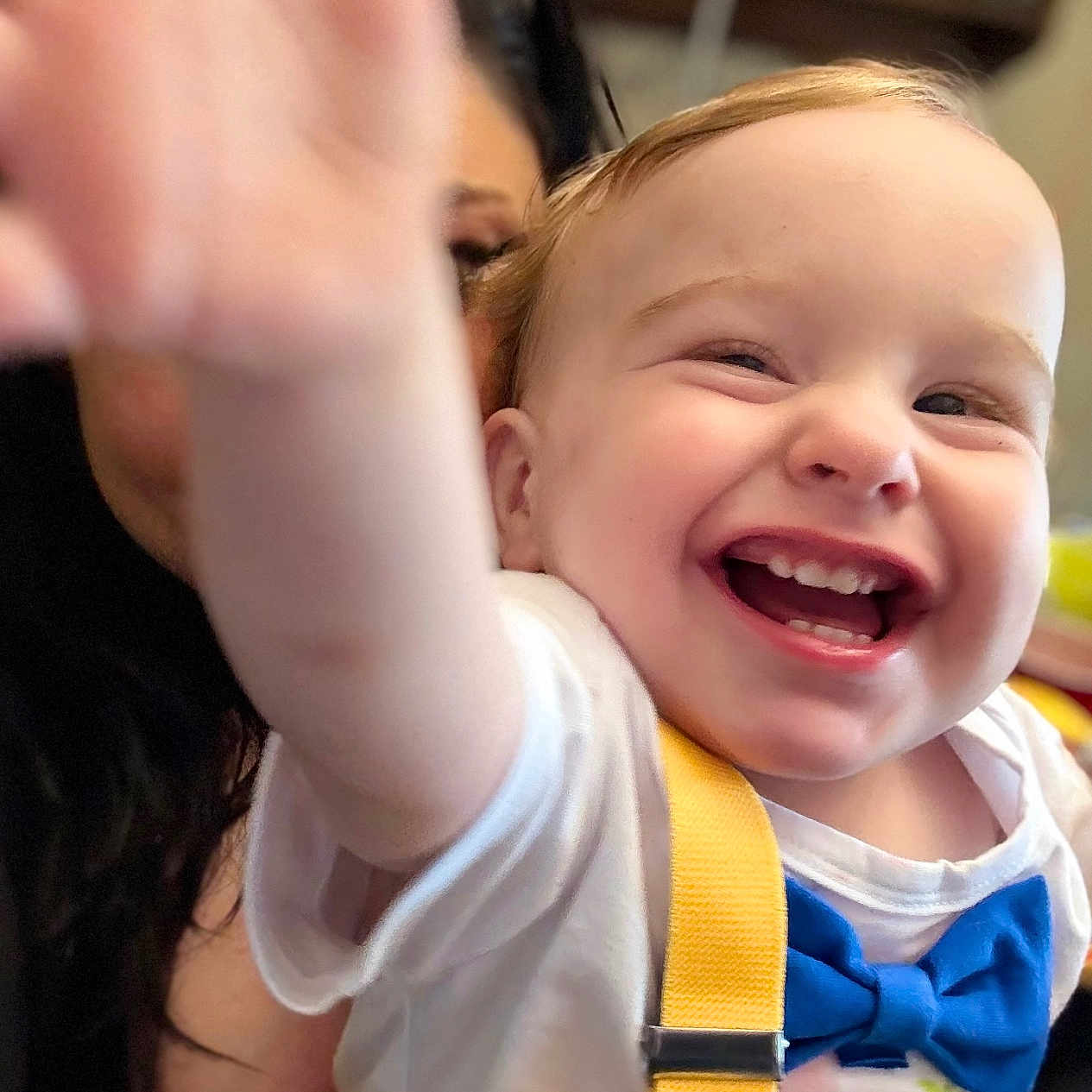 Hunter is registered to the contest to win money with this photo: adult, baby, blue_bow_tie, child, closeup, cute, expression, face, family, glasses, hand, happy, indoor, joy, person, portrait, smiling, toddler, white_shirt, yellow_suspender