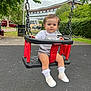 Layla joined the competition — help win amazing prizes! toddler, child, swing, playground, outdoor, park, greenery, trees, pavement, shoes, socks, clothing, person, face, expression, chain, seat, urban, background, daylight