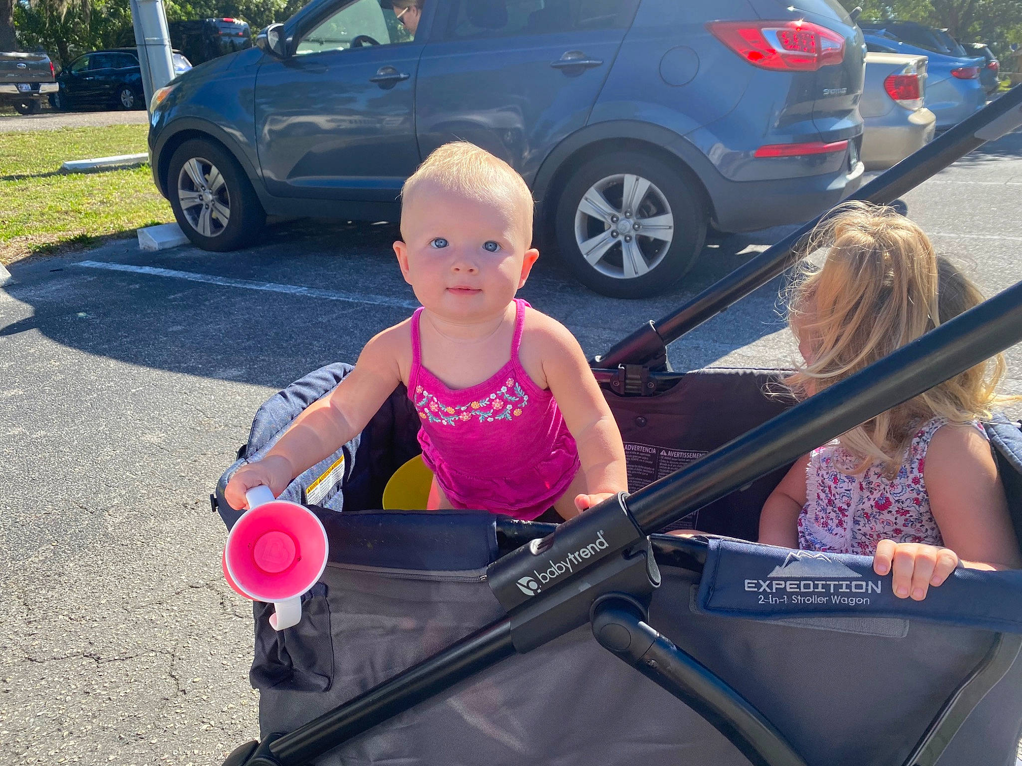 Ava joined the competition — help win amazing prizes! auto_part, automotive_design, automotive_exterior, automotive_tire, automotive_wheel_system, blue, bumper, car, electric_blue, event, hood, land_vehicle, motor_vehicle, parking, person, rim, tire, toddler, vehicle, vehicle_door