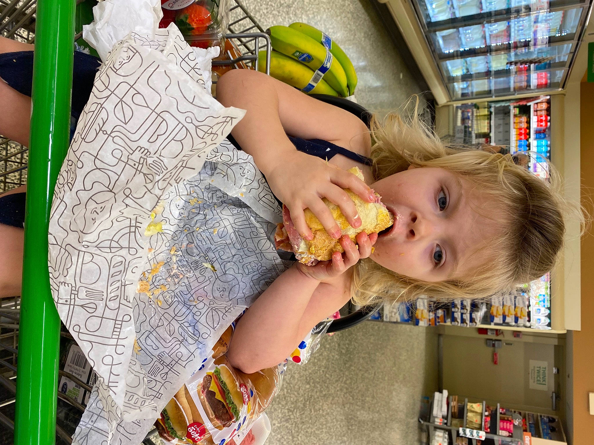 Kyla is registered to the contest to win money with this photo: baby, bookcase, child, customer, fashion_accessory, finger, fun, grocery_store, hairstyle, happy, leisure, pattern, person, play, retail, room, shelf, shelving, thigh, toddler