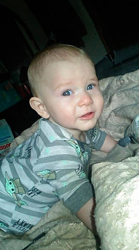 Augustus is registered to the contest to win money with this photo: arm, baby, baby_toddler_clothing, cheek, child, chin, comfort, cool, ear, eye, finger, head, human_body, iris, mouth, nose, person, skin, sleeve, standing