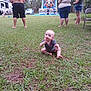 baby, grass, outdoor, people, inflatable_slide, child, adult, backyard, casual, summer, family, play, fun, relaxation, nature, event, group, barefoot, clothing, vacation