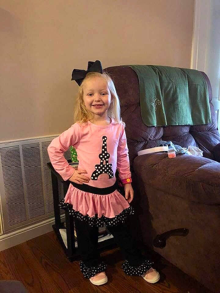 Ally is registered to the contest to win money with this photo: baby_toddler_clothing, child_model, comfort, couch, floor, flooring, interior_design, joy, laminate_flooring, laugh, living_room, mouth, person, sleeve, sock, sofa_bed, wood_flooring