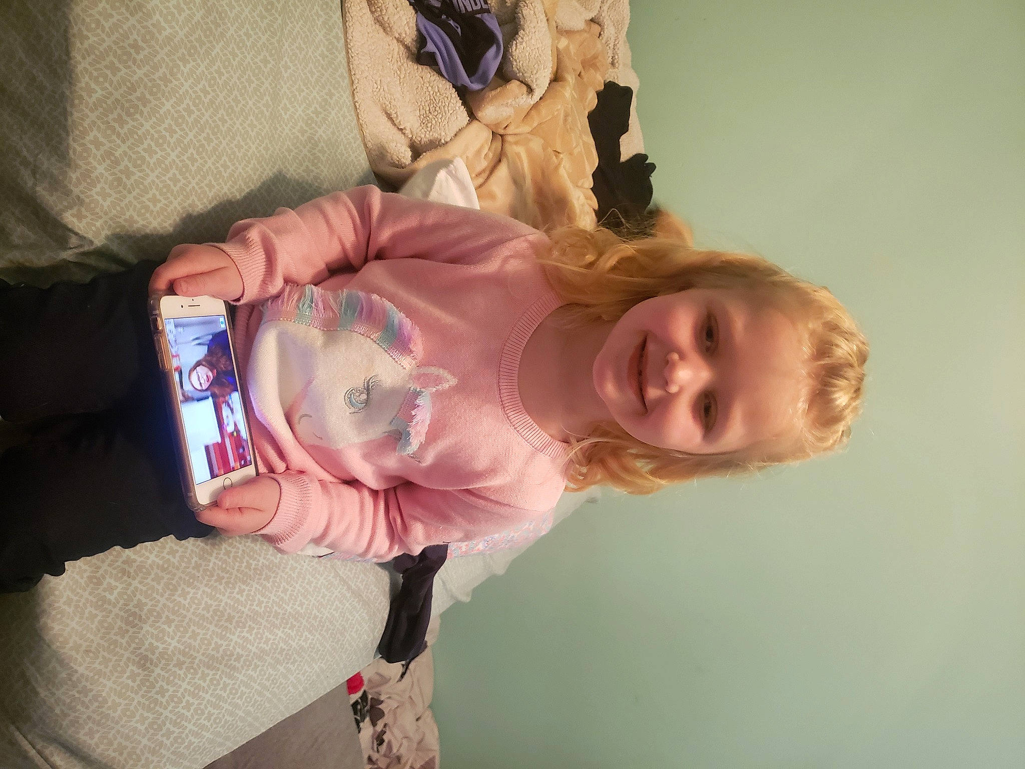 Ally is registered to the contest to win money with this photo: baby, baby_toddler_clothing, blond, communication_device, display_device, gadget, happy, joy, mobile_device, mobile_phone, person, portable_communications_device, smartphone, telephone, telephony, toddler