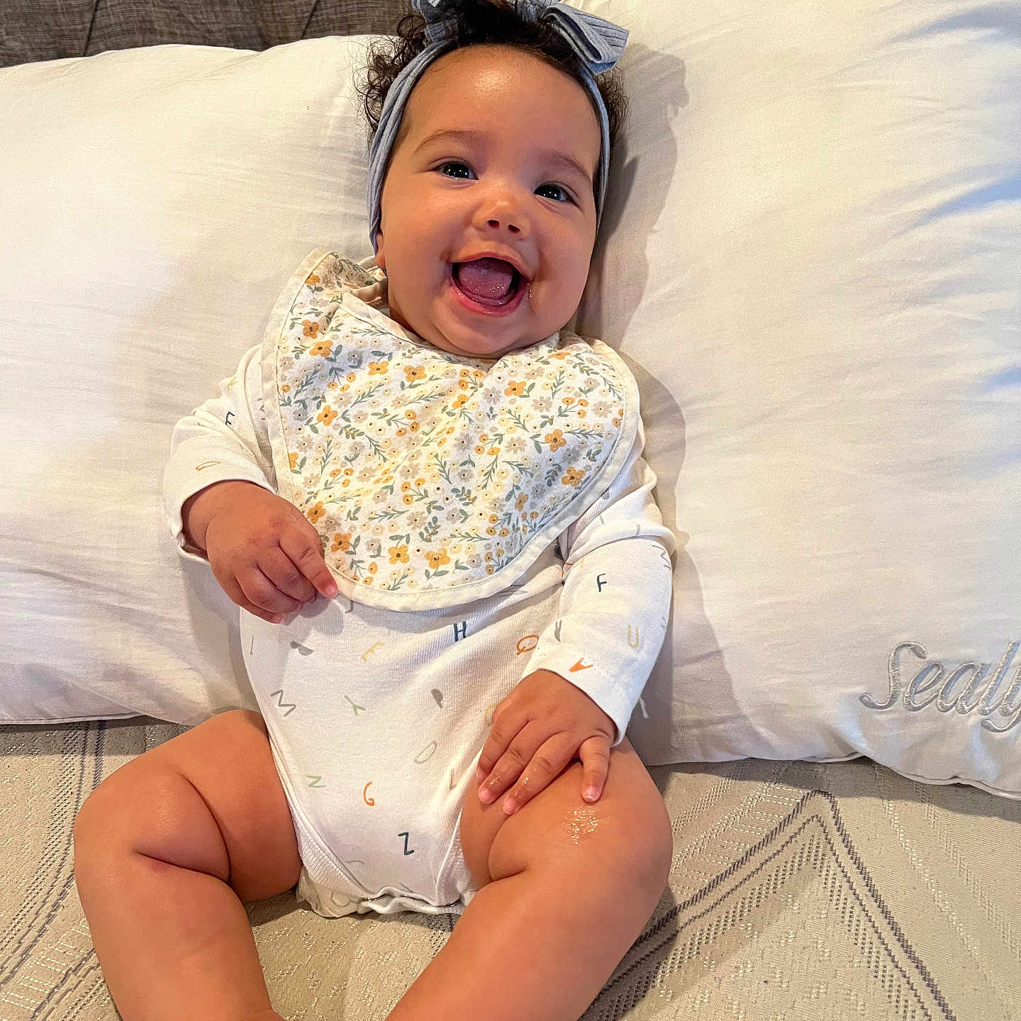 Maverick is registered to the contest to win money with this photo: baby, babylaughing, cushion, face, happy, head, homedecor, laughing, person, photography, portrait, sitting, smile