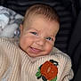 baby, child, smiling, face, knitted_sweater, pumpkin_patch, cozy, cute, portrait, infant, happy, closeup, warm_clothing, autumn, baby_face, person, head, cheeky, cute_expression, soft_texture