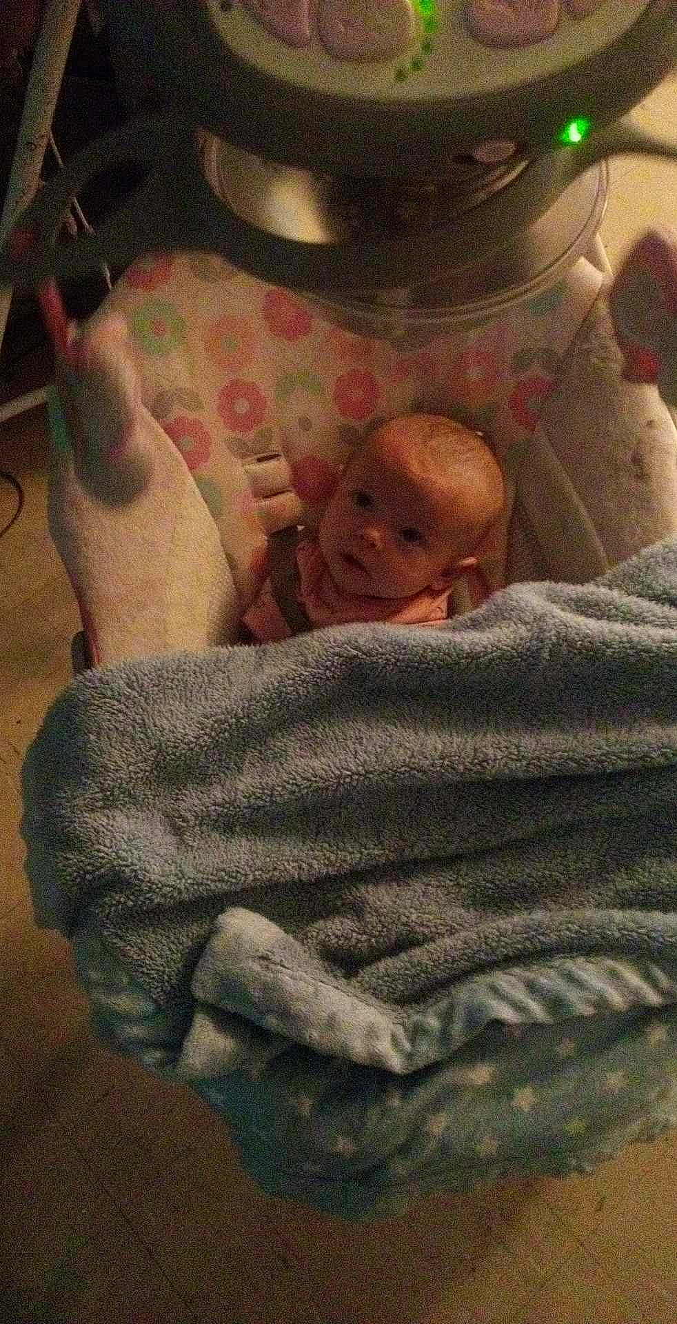 Skylar is registered to the contest to win money with this photo: baby, bedding, child, comfort, flesh, flooring, foot, human_leg, linens, nap, person, plastic, room, sitting, sleep, thumb, toddler, wood, wool, woolen