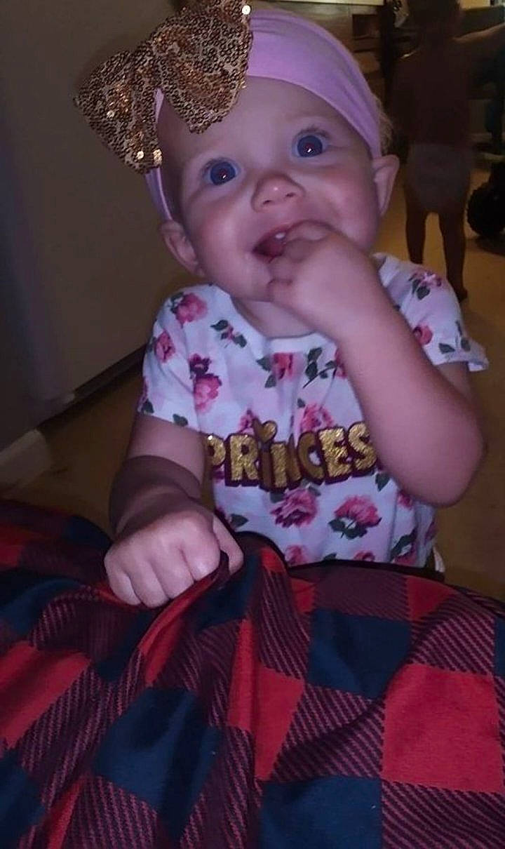 Alivia joined the competition — help win amazing prizes! baby, baby_toddler_clothing, cap, cheek, child, costume_hat, event, fashion_accessory, happy, head, headwear, magenta, party_hat, pattern, person, pink, sitting, skin, sleeve, smile