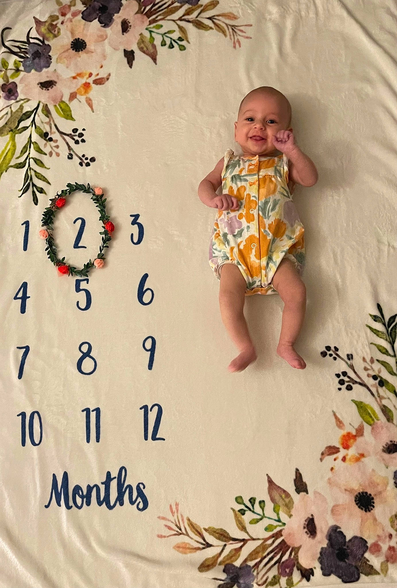 Blair is registered to the contest to win money with this photo: art, baby, baby_products, baby_toddler_clothing, child, floral_design, font, happy, illustration, linens, ornament, pattern, pedicel, person, sleeve, smile, textile, toddler, visual_arts, white