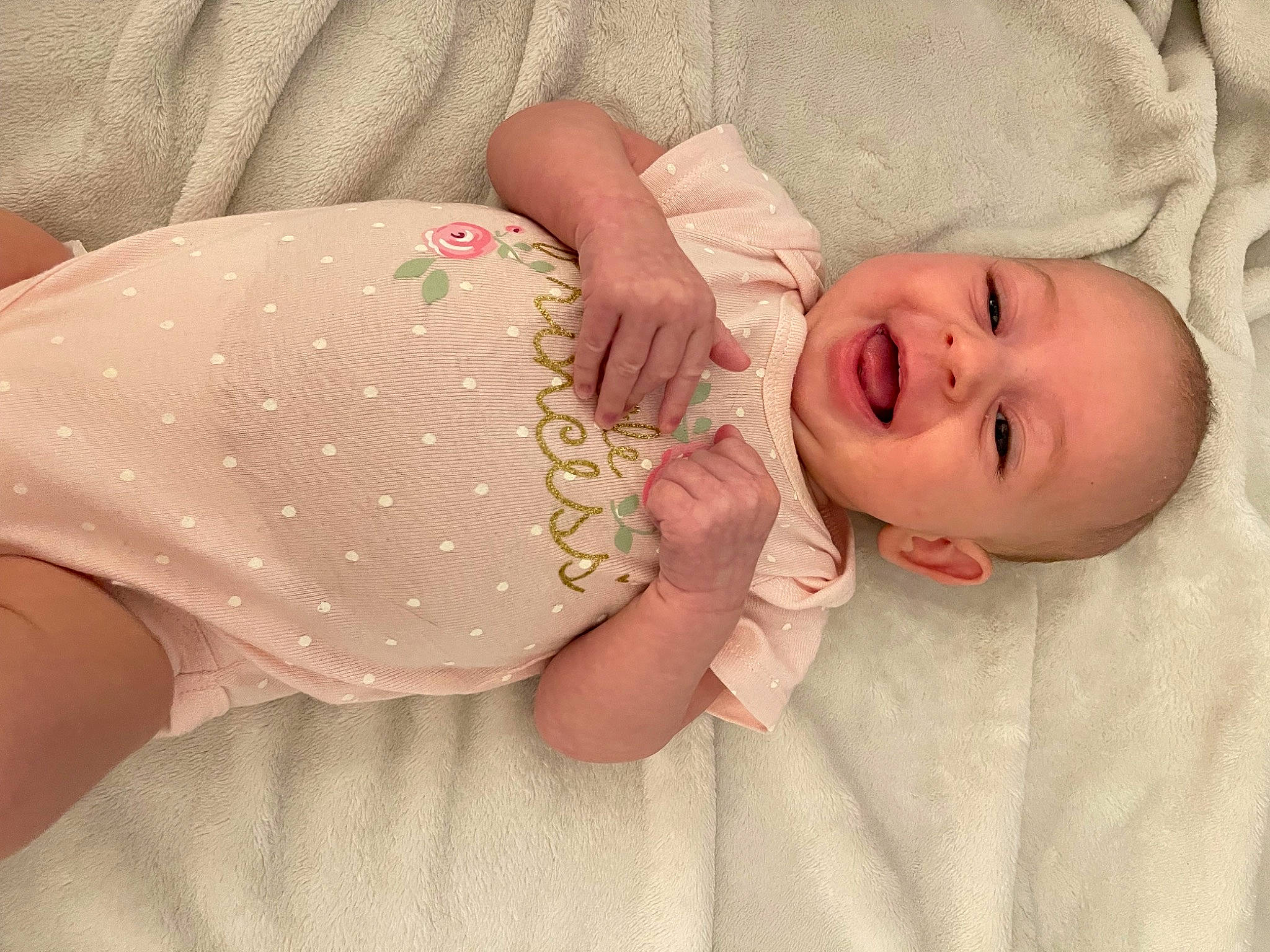 Blair is registered to the contest to win money with this photo: baby, baby_sleeping, baby_toddler_clothing, cheek, comfort, eye, face, finger, head, headgear, human_body, linens, lip, nose, person, skin, sleeve, smile, textile, thumb