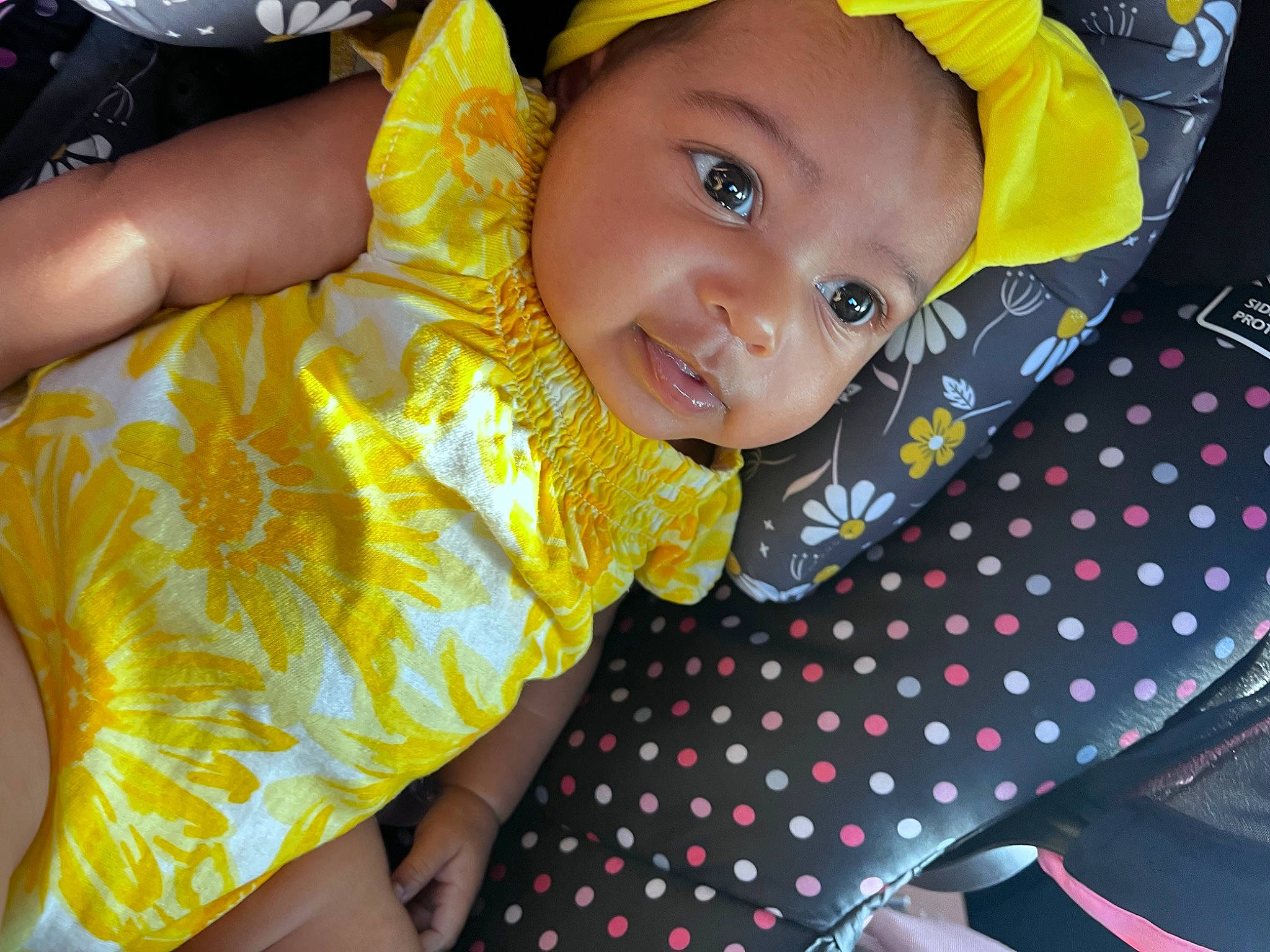 Nova is registered to the contest to win money with this photo: baby, baby_toddler_clothing, child, event, eye, face, facial_expression, fashion_accessory, fun, grass, happy, head, leisure, light, pattern, person, sleeve, smile, t_shirt, toddler