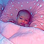 Naïsmée participe au concours pour gagner de l'argent avec cette photo : baby, infant, blanket, pink, pillow, polka_dot, bed, sleeping_area, face, cute, newborn, wrapped, soft, child, indoors, resting, young, person, cozy, teddy_bear