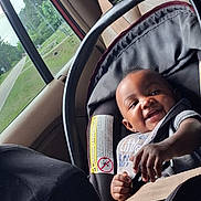 Bradley joined the competition — help win amazing prizes! baby, car_seat, child, infant, smiling, seatbelt, vehicle_interior, window, greenery, safety, happy, portrait, person, young_child, clothing, car, seat, cute, infant_care, travel