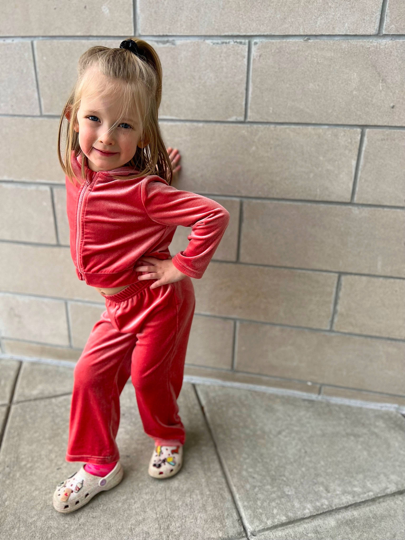 Ava Rose joined the competition — help win amazing prizes! active_pants, baby_toddler_clothing, blond, brick, child, electric_blue, flooring, hair, happy, human_leg, joy, knee, leg, magenta, pattern, person, sitting, sleeve, smile, sportswear