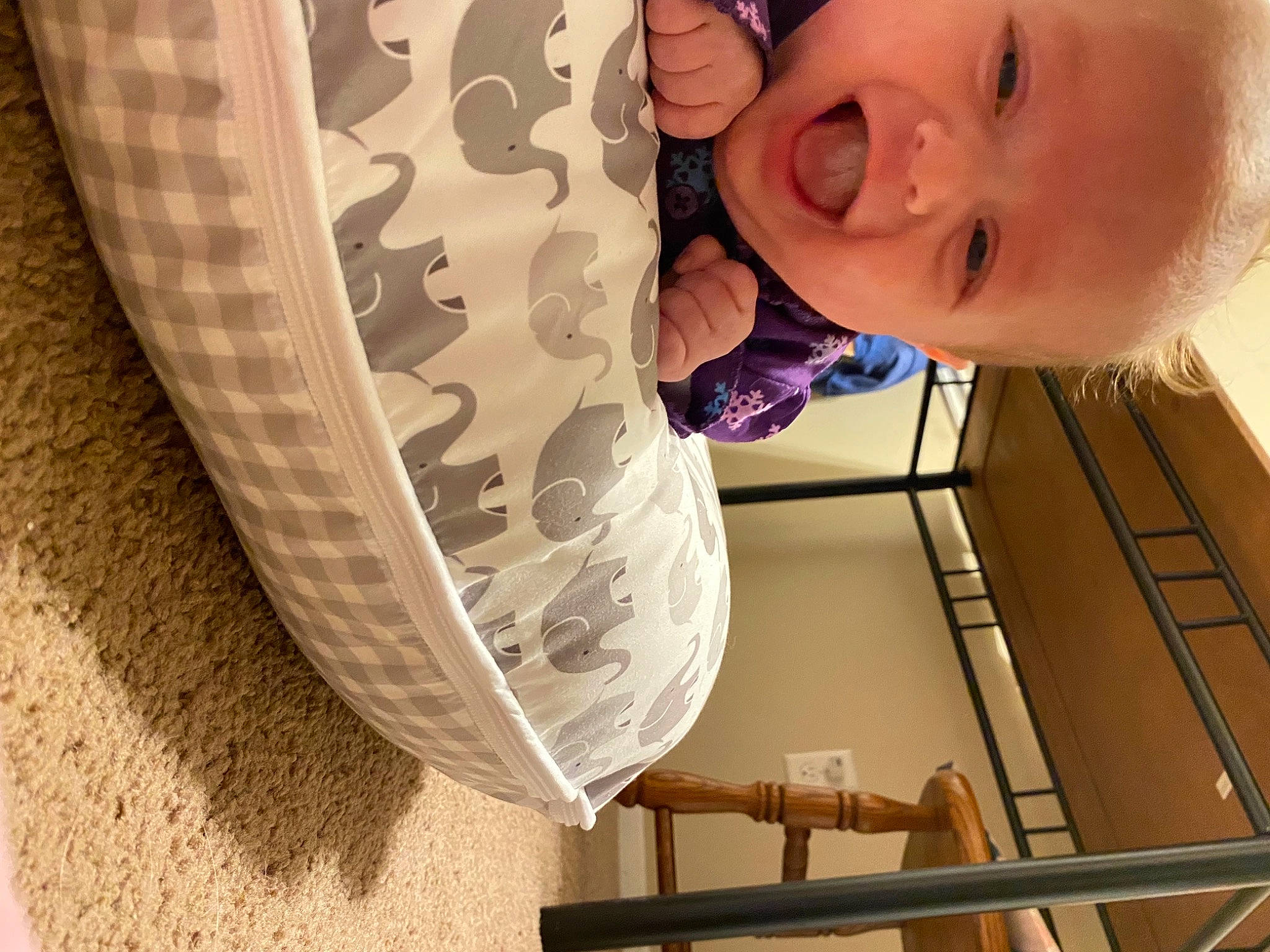 Emerson is registered to the contest to win money with this photo: automotive_tire, black, chin, eye, eyebrow, eyelash, face, hair, happy, head, jaw, neck, nose, person, photograph, smile, toddler, white, window, wood