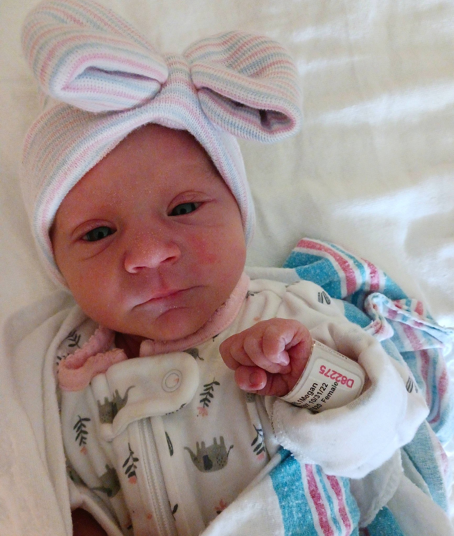 Sophia is registered to the contest to win money with this photo: baby, baby_products, baby_safety, baby_sleeping, baby_toddler_clothing, cheek, child, chin, comfort, eye, face, fashion_accessory, happy, head, headwear, linens, peach, person, pink, room