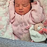 newborn, baby, sleeping, pink_sweater, blanket, teddy_bear, soft_texture, cozy, infant, cute, child, resting, indoors, portrait, warm, snug, peaceful, toy, closeup, comfort