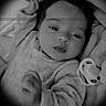 Jannah a rejoint le concours — aidez-le/la à gagner de superbes lots ! baby, infant, blanket, pacifier, portrait, black_and_white, newborn, clothing, face, head, expression, hand, lying_down, soft_lighting, vignette, cute, child, person, indoors, sleepwear