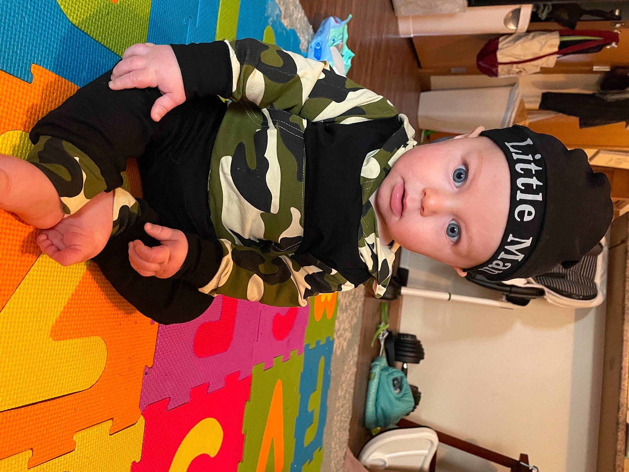 Grant is registered to the contest to win money with this photo: baby, baby_products, baby_toddler_clothing, child, costume, event, fun, happy, hat, headwear, helmet, pattern, person, play, room, shelf, smile, surprise, toddler