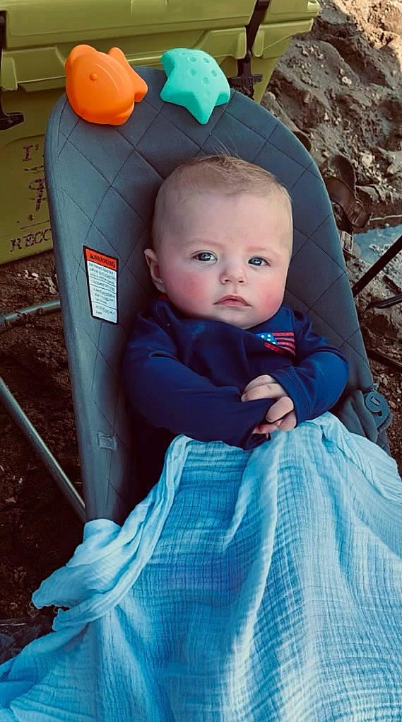 Sutton joined the competition — help win amazing prizes! baby, baby_carriage, baby_products, baby_toddler_clothing, blue, cheek, child, comfort, electric_blue, fun, pattern, person, product, recreation, sitting, toddler, wood