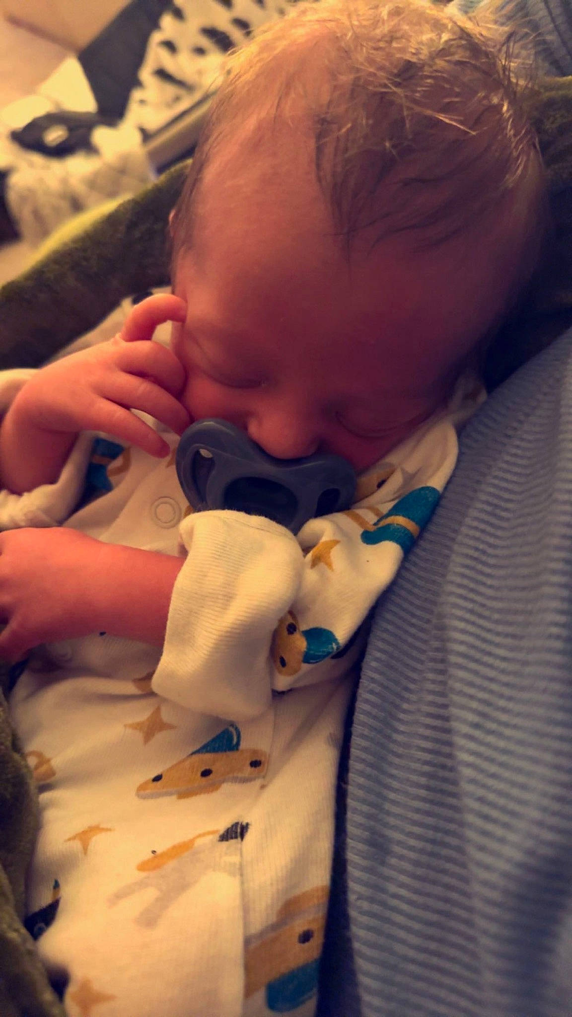 Sutton is registered to the contest to win money with this photo: baby, baby_products, baby_sleeping, baby_toddler_clothing, cheek, child, comfort, ear, eyebrow, eyelash, finger, happy, human_body, lip, mouth, nail, nose, person, skin, thumb