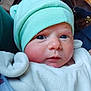 baby, infant, hat, mint_green, blanket, face, blue_eyes, clothing, indoors, portrait, cute, newborn, warm, soft, person, headwear, expression, closeup, resting, cozy
