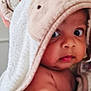 Carol is registered to the contest to win money with this photo: baby, child, towel, animal_hood, cute, skin, face, eyes, arm, expression, indoors, soft, fabric, comfort, closeup, portrait, newborn, infant, warm, cozy