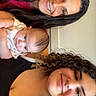 Arielle joined the competition — help win amazing prizes! baby, woman, smiling, curly_hair, portrait, indoor, family, person, clothing, face, head, skin, hair, child, casual, happy, people, closeup, background, young