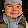 baby, child, smile, face, hat, blue_hat, bib, car_seat, straps, closeup, infant, cute, happy, cheeks, clothing, person, portrait, indoors, young_child, baby_fashion