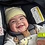Ryan joined the competition — help win amazing prizes! baby, smiling, car_seat, knit_hat, blanket, milk_bottle, child, cute, happy, face, person, infant, seatbelt, soft, warm, indoors, clothing, portrait, comfort, hand