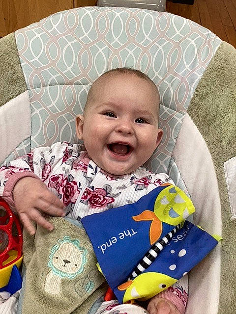 Leyna is registered to the contest to win money with this photo: baby, baby_products, baby_sleeping, baby_toddler_clothing, cheek, child, comfort, face, fashion_accessory, happy, linens, pattern, person, product, sitting, skin, sleeve, smile, textile, toddler