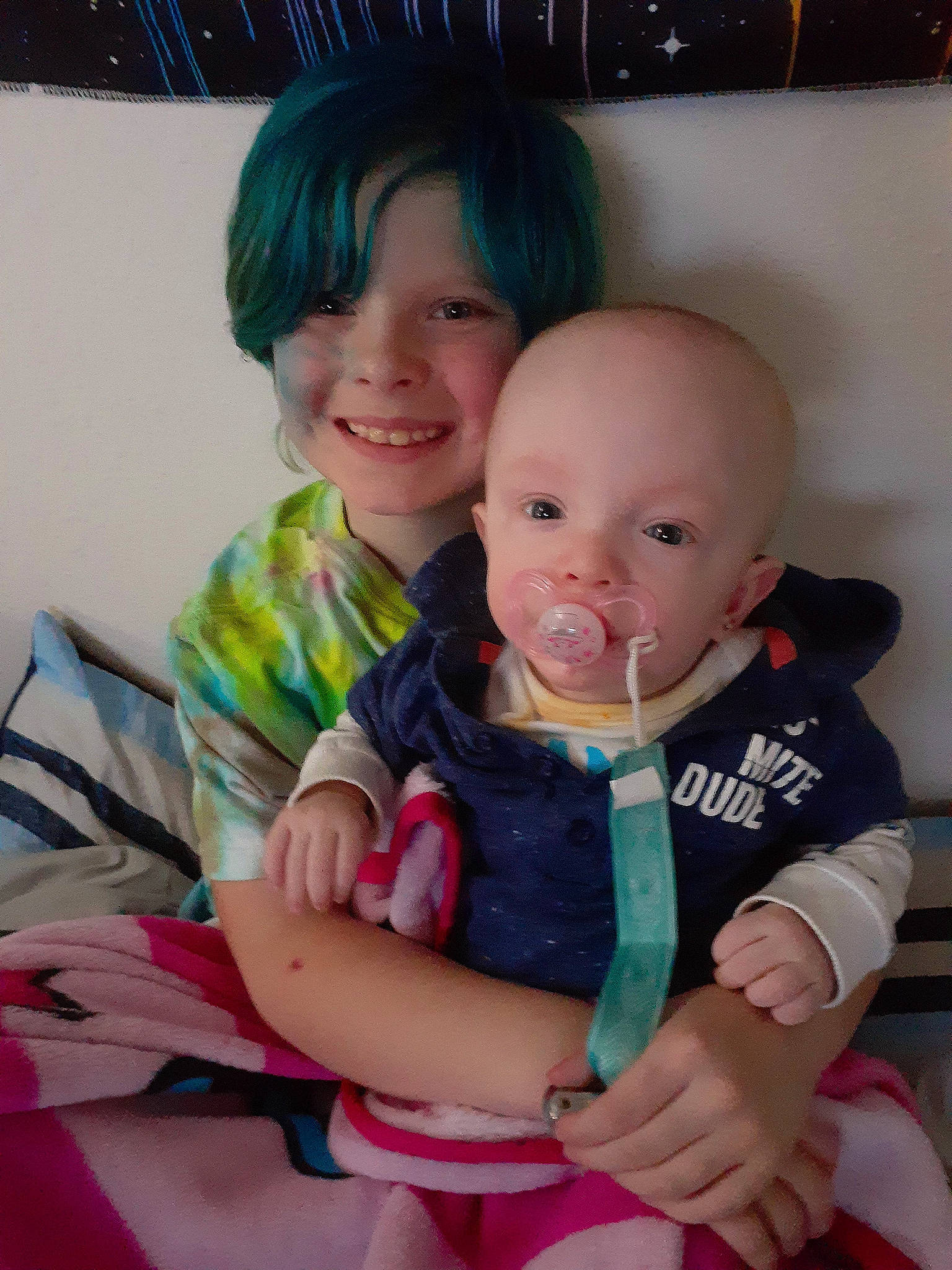 Skye is registered to the contest to win money with this photo: abdomen, baby, baby_toddler_clothing, cheek, child, chin, eye, finger, fun, gesture, happy, human_body, iris, joy, nose, person, pink, sitting, skin, sleeve