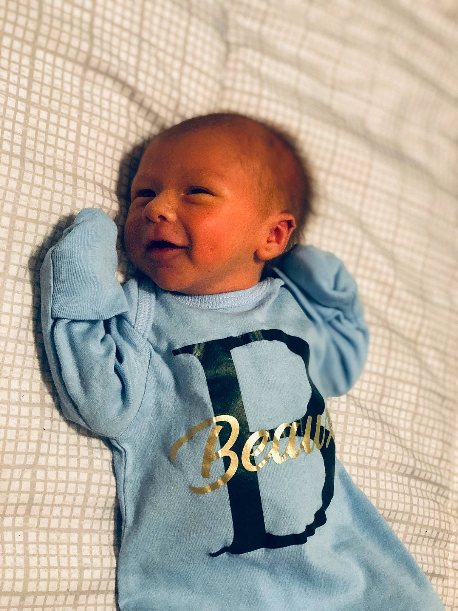 Beaux is registered to the contest to win money with this photo: baby, baby_products, baby_sleeping, baby_toddler_clothing, bib, cheek, child, collar, comfort, electric_blue, happy, hood, linens, pattern, person, sitting, skin, sleeve, smile, t_shirt